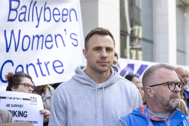 Former Ireland rugby International Tommy Bowe, standing in solidarity with those protesting against cuts to community funding programs outside the offices of Chris Heaton-Harris, Secretary of State for Northern Ireland, at the Northern Ireland Office (NIO) at Erskine House, Belfast.