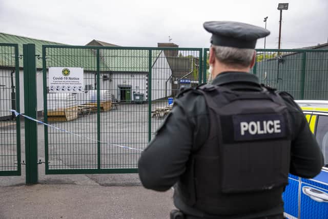 An officer from the PSNI at the scene following the shooting of 42 year old Sean Fox at the clubhouse of Donegal Celtic Football Club, in west Belfast.