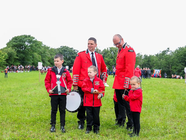 Band musicians pictured in the field before the parade starts