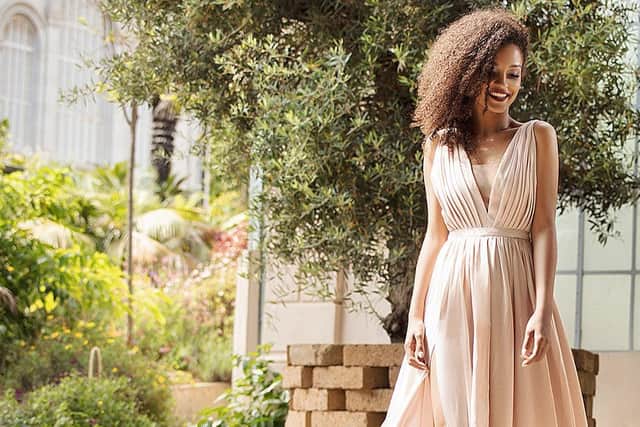 Wearing neutrals or pastels to a wedding is an ideal option