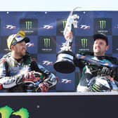 Supersport TT winner Michael Dunlop celebrates his win on Wednesday with runner-up Peter Hickman (left) and Dean Harrison