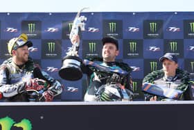 Supersport TT winner Michael Dunlop celebrates his win on Wednesday with runner-up Peter Hickman (left) and Dean Harrison