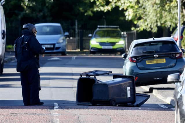 A soldier in a bomb suit at the scene of the explosion this morning