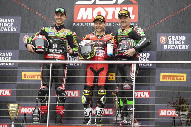 World Superbike champion Alvaro Bautista celebrates his victory in Race Two on Sunday at Phillip Island in Australian with runner-up Jonathan Rea and Alex Lowes, who was third.