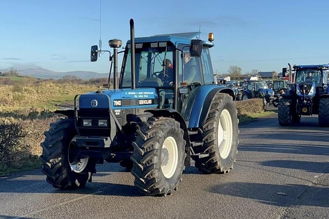 Rachel Graham and Stuart Dunlop join the run in the New Holland 7840 at the tractor and truck run. Picture: Rathfriland YFC