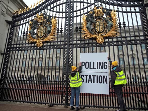 Supporters from the campaign group Republic unveiling a polling station sign on the railings of Buckingham Palace in London on Wednesday - the first in a series of protests against the King's coronation.



NOTE TO EDITORS: This handout photo may only be used in for editorial reporting purposes for the contemporaneous illustration of events, things or the people in the image or facts mentioned in the caption. Reuse of the picture may require further permission from the copyright holder.