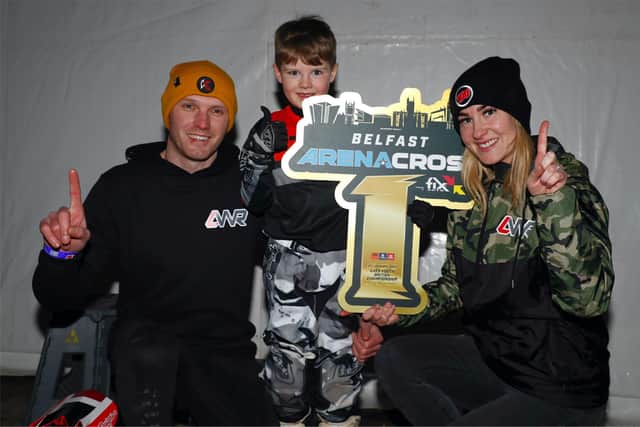 Larne rider Jax Knox was the overall winner of the AXE5 electric class at the Arenacross Tour in Belfast. Jax is pictured with his mum Anita and dad Adrian.