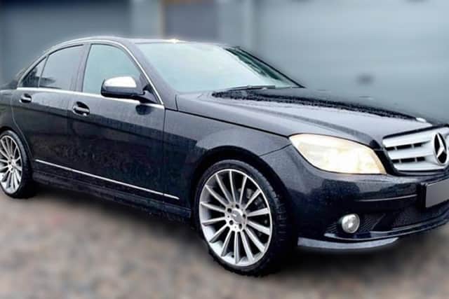 A black Mercedes Benz C-Class (W204) 4-door saloon (2007/8 - 2014) similar to the one that police believe was used in the attempted murder of PSNI Detective Chief Inspector John Caldwell