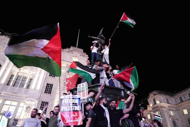 People take part in a Palestine Solidarity Campaign demonstration in Piccadilly Circus, London, as the death toll rises amid ongoing violence in Israel and Gaza following the attack by Hamas. Picture date: Monday October 9, 2023. PA Photo. Photo credit should read: Jordan Pettitt/PA Wire
