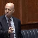 Jon Burrows (pictured speaking in the Assembly today) was a police officer for 22 years, and held command positions in the force