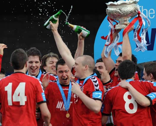 Andy Hunter (centre) celebrating with Portadown team-mates after beating Newry City in 2009. (Photo by Colm Lenaghan/Pacemaker)