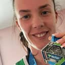 Finisher's medal: Bushmills woman Laura Harpur said she was 'ecstatic' after completing a relay in the Belfast Marathon. A cancer survivor, she helped organise 20 runners to raise money for Macmillan Cancer.