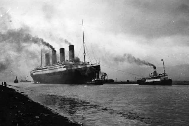 The RMS Titanic leaving Belfast to start her trials, being pulled by tugs, shortly before her disastrous maiden voyage of April 1912. (Photo by Topical Press Agency/Getty Images)
