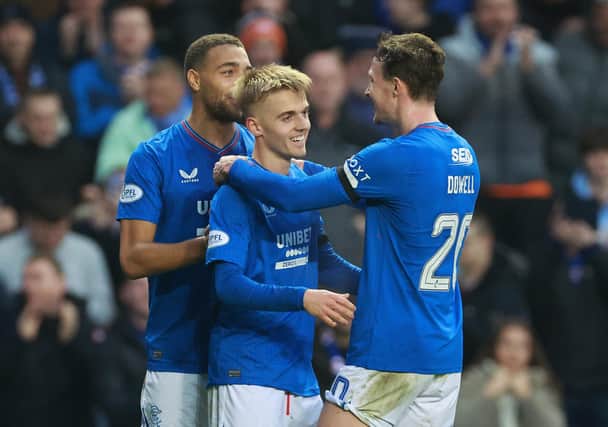 Rangers' Northern Ireland-born Ross McCausland (centre) celebrates with Cyriel Dessers (left) and Kieran Dowell after scoring in the victory over Kilmarnock. (Photo by Steve Welsh/PA Wire)