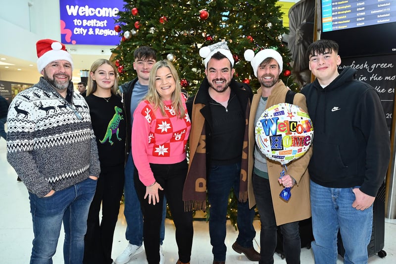 As Santa's arrival draws ever closer, friends and families were reunited at arrivals back home in Northern Ireland.  Amanda Morrow meeting her brother Ben and his husband Hugh who have flown home from Australia, Her fiancé Phil and her children Matthew and Nathan reunited for Christmas at George Best Belfast City Airport today
Picture By: Arthur Allison: PacemakerPress.