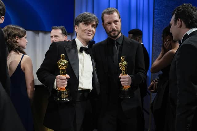 Cillian Murphy, winner of the award for best performance by an actor in a leading role for "Oppenheimer," left, poses with Mstyslav Chernov, winner of the award for best documentary feature film for "20 Days in Mariupol" at the Governors Ball after the Oscars on Sunday, March 10, 2024, at the Dolby Theatre in Los Angeles. (AP Photo/John Locher)