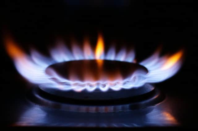 A lit ring on a gas hob. PA image