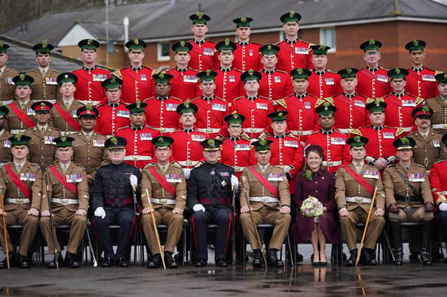 Regimental Lieutenant Colonel, Major General Sir Christopher Ghika, (fifth left) and his wife, Lady Ghika, posing with members of the Irish Guards for a family picture at Mons Barracks, Aldershot