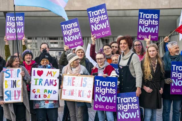 Transgender activists outside the Scottish Parliament, Edinburgh, in 2022; JK Rowling has been extremely critical of such campaigners