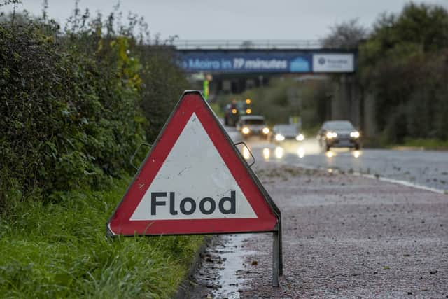 A road sign advising drivers of flooding on the A26 outside the village of Moira in Northern Ireland. Picture date: Monday October 30, 2023. PA Photo. See PA story WEATHER Rain . Photo credit should read: Liam McBurney/PA Wire