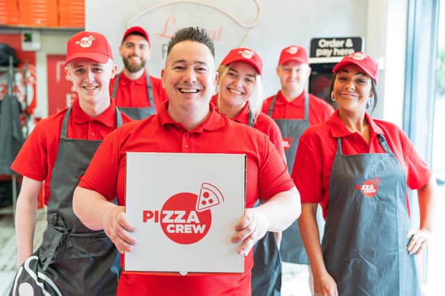Ciaran Kelly, the man behind Pizza Crew, celebrates the launch of the new name with some of the crew from his stores