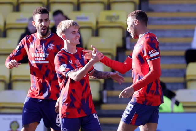 Ross McCausland celebrates with Cyriel Dessers after he opened the scoring for Rangers against Livingston. PIC: Steve Welsh/PA Wire.