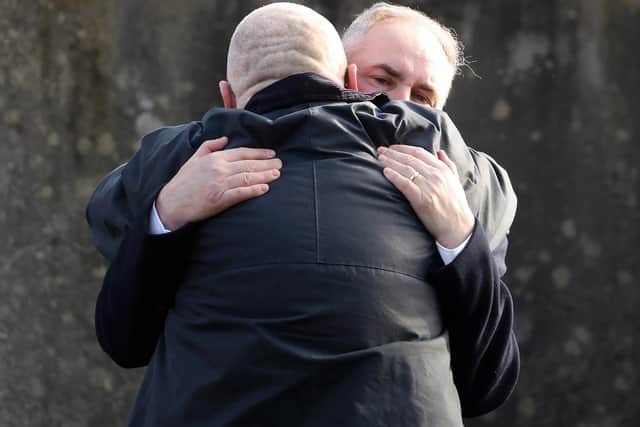 Funeral of Alex and Ann Easton at Bangor Abbey, Co. Down - Alex Easton is comforted after the funeral service.