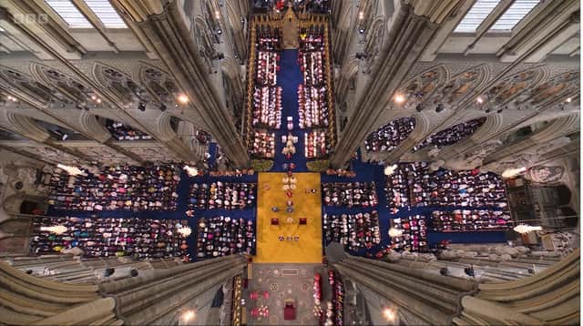 Westminster Abbey seen from above during the coronation of King Charles on Saturday May 6 2023. Ben was sitting beyond the two arches to the right of image, where you can glimpse seating. Journalists were seated in the north transept, that body of the church to the right of the image. The sanctuary and altar are to the bottom of the intersection in the middle of the picture. The media seating under the arches was facing the back of choir stalls towards the top of the picture. The main body of the church is above that, outside of the image. Screengrab from the BBC