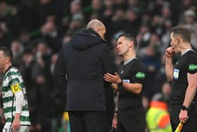 Rangers manager Philippe Clement speaks with referee Nick Walsh after the cinch Premiership match against Celtic at Parkhead