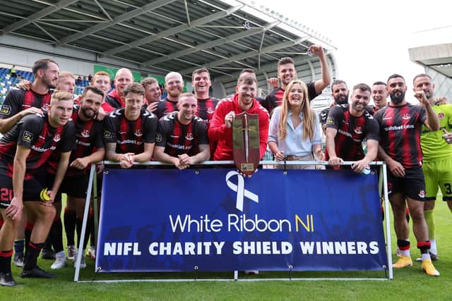 Crusaders players celebrate after lifting the 2022 Charity Shield