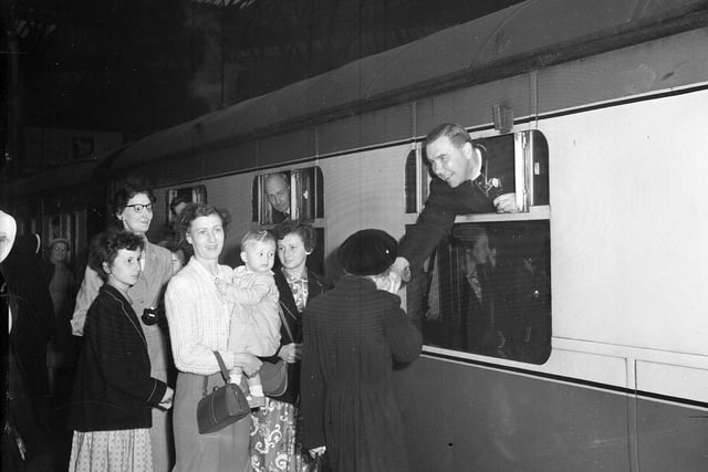 A Lourdes Pilgrimage leaving Princes Street Station, with Cardinal Gray bidding farewell to friends, in July 1955.