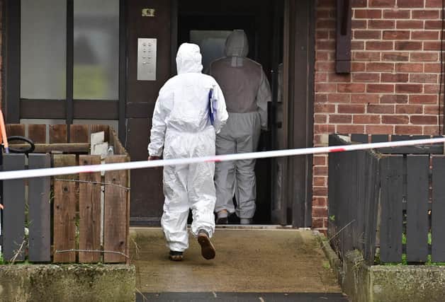Forensics at the scene as Police have launched a murder investigation following the death of a man in his 30s in the Rathcoole area of Newtownabbey, County Antrim, on Friday.