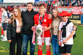 James Simpson celebrates lifting the Gibson Cup with his family. (Photo by Andrew McCarroll/Pacemaker Press)