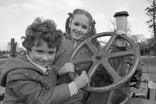 Pictured in April 1982 are Lindsay Brown (5) and Shelley Cave (10) from Newtownards having fun with a traction engine, part of the outdoor exhibitions at the Folk and Transport Museum, Cultra. Picture: News Letter archives