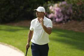 Brooks Koepka waves after his putt on the 13th hole during the second round of the Masters golf tournament at Augusta National Golf Club.