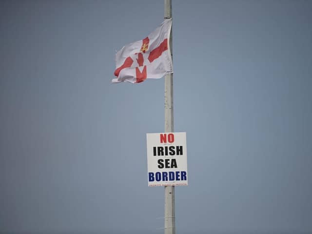 Flag at the entrance to Larne harbour, which is one of the main entry points between Northern Ireland and the rest of the United Kingdom, on September 7, 2021