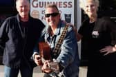 Bar owner Paul Donegan, musician Lee Hedley and Open House Festival director Alison Gordon strike a chord for this weekend's Bangor Music Trail.