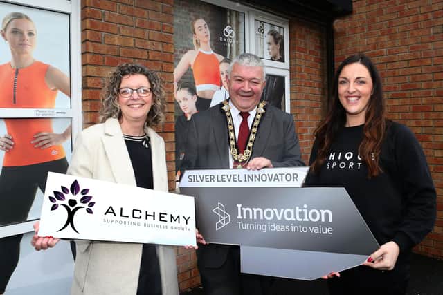 Jenna McCorkell from Chique Sport (right) pictured with the Mayor of Causeway Coast and Glens Borough Council, Councillor Ivor Wallace, and Economic Development Officer, Louise Pollock.