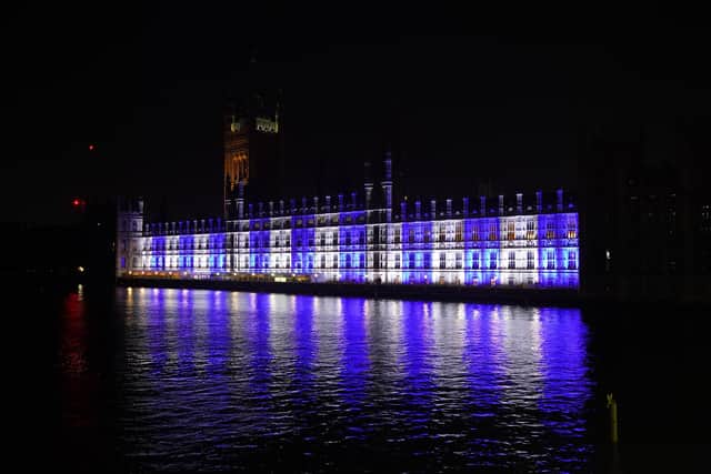 The Palace of Westminster is lit up in the colours of Israel's flag for victims and hostages of Hamas attacks, as the death toll rises amid ongoing violence in Israel and Gaza following the attack by Hamas on Saturday. Picture date: Monday October 9, 2023. PA Photo. See PA story POLITICS Israel. Photo credit should read: Lucy North/PA Wire