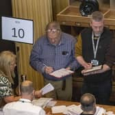 Green Party NI leaders Mal O'Hara (centre) tallying ballots as ballot boxes are opened in Belfast City Hall. He later lost his seat to Carl Whyte of the SDLP