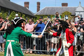 King William III ( in red) once again defeated his enemy James II in the annual Sham Fight.