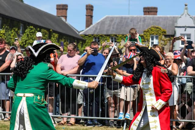 King William III ( in red) once again defeated his enemy James II in the annual Sham Fight.