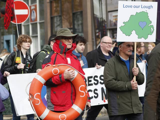 Save Lough Neagh protesters take part in a rally outside Belfast City Hall. Picture: Peter Morrison/PA Wire