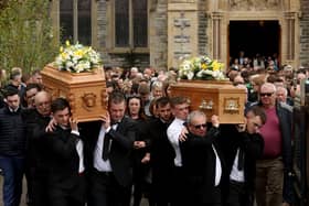 The coffins of Dan and Christine McKane, two of the three victims of the Aughnacloy crash, are carried from the Church of The Immaculate Conception in Strabane, following their funeral.