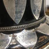 Distillery recorded as 1885–86 winners among the plates on the base of the original Irish Cup. PIC: Irish Football Association