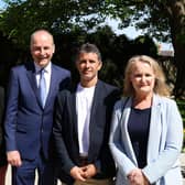 Brazilian delivery driver Caio Benicio with Candidate Isabell Oliveira (left) , Fianna Fail leader Micheal Martin and Senator Mary Fitzpatrick at Arbour Hill Cemetary, Dublin. 
Benicio, who was hailed a hero after intervening in a knife attack in Parnell Square East on November 23 last year, has been announced that he will be running as a Fianna Fail candidate for Dublin North Inner City. Picture date: Sunday April 21, 2024. PA Photo. See PA story IRISH Benicio. Photo credit should read: Cillian Sherlock/PA Wire
