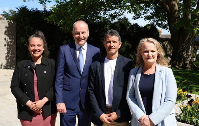Brazilian delivery driver Caio Benicio with Candidate Isabell Oliveira (left) , Fianna Fail leader Micheal Martin and Senator Mary Fitzpatrick at Arbour Hill Cemetary, Dublin. 
Benicio, who was hailed a hero after intervening in a knife attack in Parnell Square East on November 23 last year, has been announced that he will be running as a Fianna Fail candidate for Dublin North Inner City. Picture date: Sunday April 21, 2024. PA Photo. See PA story IRISH Benicio. Photo credit should read: Cillian Sherlock/PA Wire