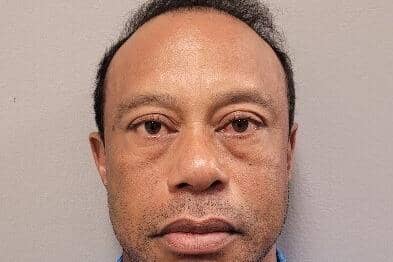 This handout photo - provided by the Martin County Sheriff's Office - shows Tiger Woods as he poses for a booking photo after his arrest on March 27. (Photo by Martin County Sheriff's Office via AP)