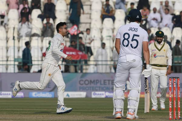 Pakistan's Abrar Ahmed (L) celebrates after taking the wicket of England's Will Jacks (C) during the first day of the second cricket Test match against England at the Multan Cricket Stadium on Friday. (Photo by AAMIR QURESHI/AFP via Getty Images)