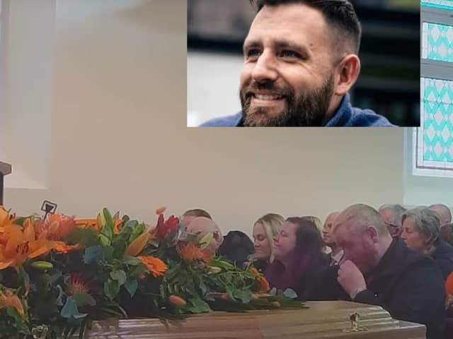 Flowers on the coffin of Afghanistan veteran William Onion in Antrim as his family look on during his funeral. He passed away after a climbing accident on Mount Snowdon.